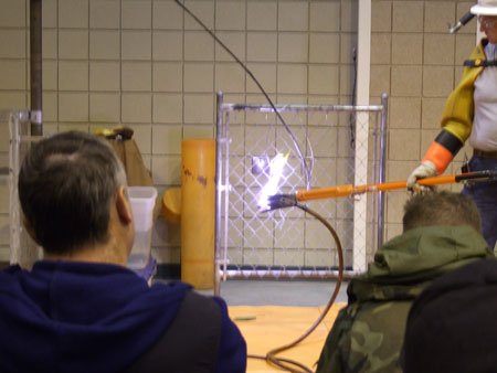 A Downed Distribution Line in Contact with a Metal Fence